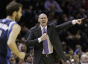 Dallas Mavericks coach Rick Carlisle signals to his players during the first half of Game 2 of the opening-round NBA basketball playoff series against the San Antonio Spurs, Wednesday, April 23, 2014, in San Antonio. (AP Photo/Eric Gay)