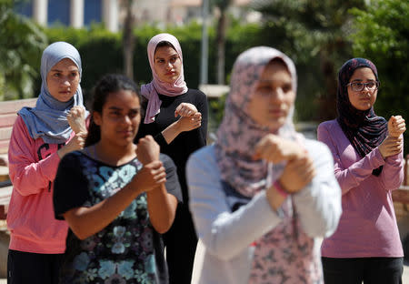 Egyptian women from Parkour Egypt "PKE" attend their training practice of parkour skills around buildings on the outskirts of Cairo, Egypt July 20, 2018. REUTERS/Amr Abdallah Dalsh