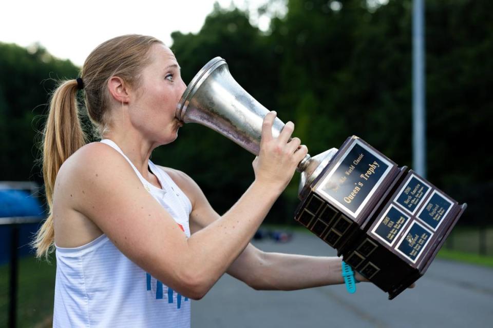 Elizabeth Laseter sips beer from the trophy she won at the 2023 Beer Mile World Classic in July. Joshua Komer/CharlotteFive