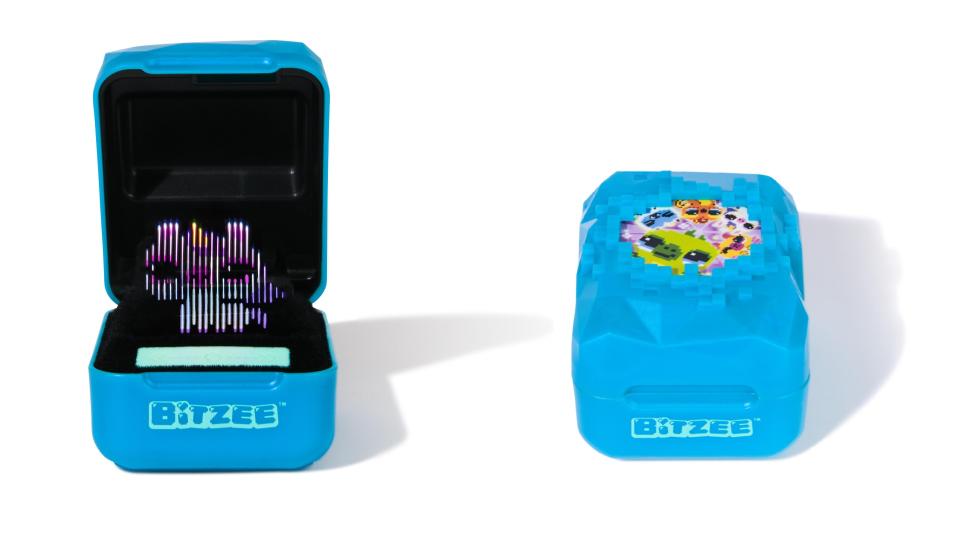 A blue Bitzee Magicals device shown displaying a unicorn (left) and closed (right)