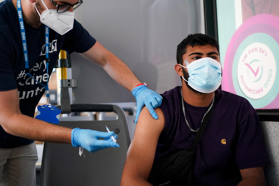 Festival goer Miles Moss receives his 2nd Pfizer vaccine dose at a Covid-19 vaccination bus at Latitude festival in Henham Park, Southwold, Suffolk. Picture date: Sunday July 25, 2021. (Photo by Jacob King/PA Images via Getty Images)