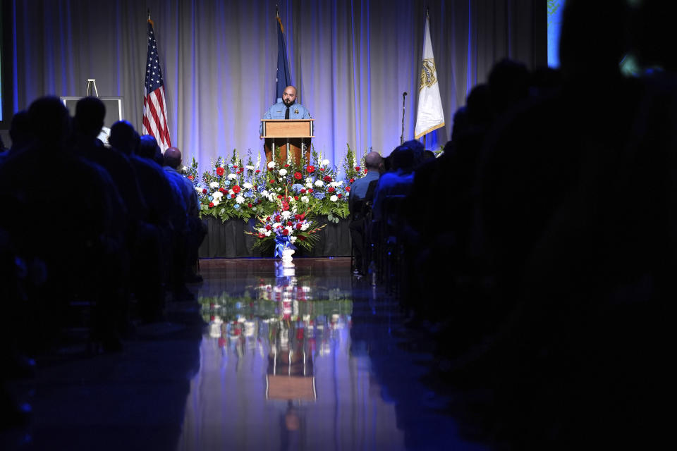 Minneapolis Police Officer Luke Weatherspoon speaks about his friend and colleague, fellow Minneapolis police Officer Jamal Mitchell, during a public memorial service for Mitchell at Maple Grove Senior High School, Tuesday, June 11, 2024, in Maple Grove, Minn. Mitchell was shot and killed while responding to a shooting on May 30, 2024. (AP Photo/Abbie Parr, Pool)