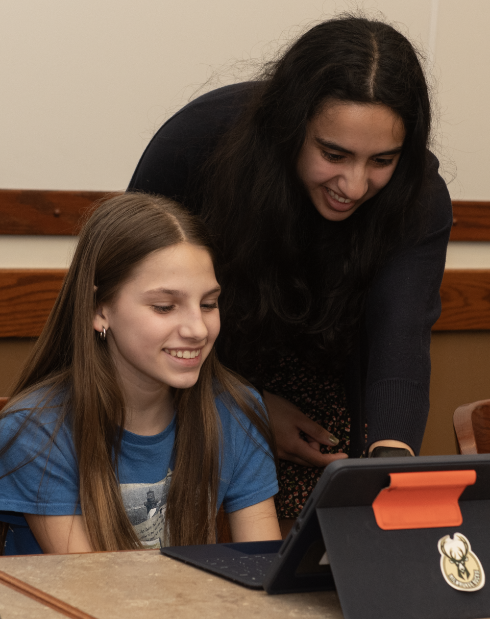 Riya Hegde, a junior at Western Reserve Academy in Hudson, recently started a project called Python Pals. Hegde, who received the NEO High School Microgrant Program to fund her endeavor, with Marissa Mallas, 11.