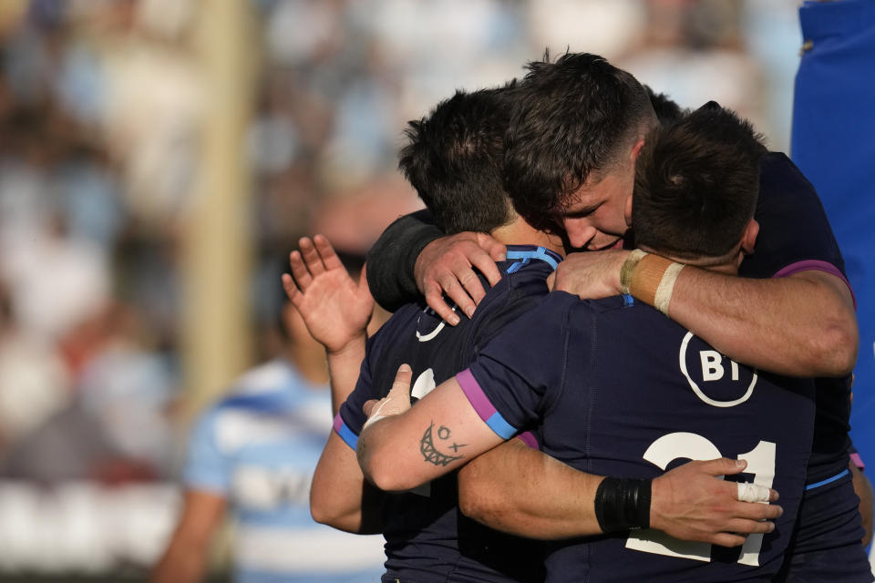 Scotland's Sam Johnson, left, celebrates with teammates after marking a try against Argentina's Los Pumas during their rugby test match in Salta, Argentina, Saturday, July 9, 2022. (AP Photo/Natacha Pisarenko)