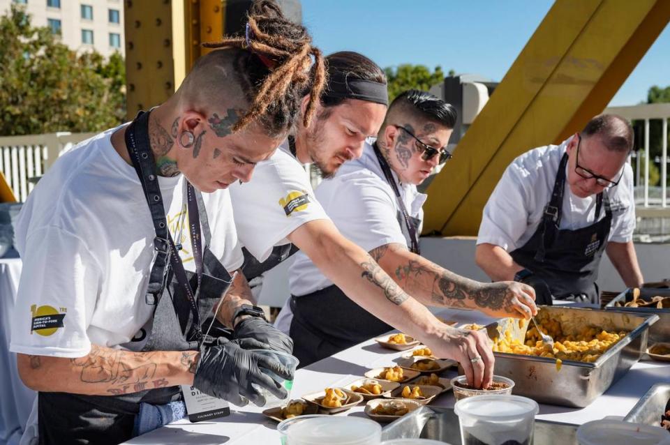 Chefs from Nixtaco Mexican Restaurant prepare a conico azul tostada with scallops, peaches, habanero aguachile and golden beets at the Tower Bridge Dinner on the Tower Bridge between Sacramento and West Sacramento on Sunday.