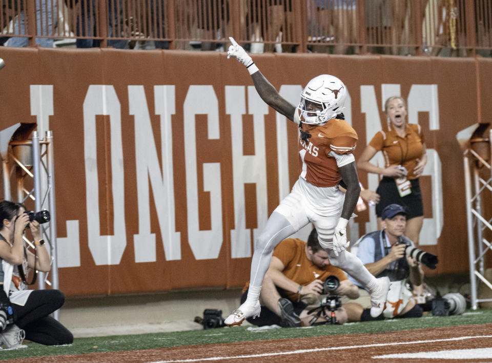 Xavier Worthy celebrates after his touchdown during the second half of an NCAA college football game against Wyoming, Saturday, Sept. 16, 2023, in Austin, Texas. (AP Photo/Michael Thomas)