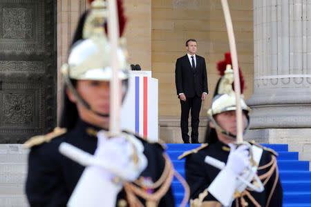 French President Emmanuel Macron stands outside the Pantheon before delivering a speech in tribute to late Auschwitz survivor and French health minister Simone Veil and her late husband Antoine Veil during a national tribute before being laid to rest in the crypt of the Pantheon mausoleum, in Paris, France, July 1, 2018 Ludovic Marin/Pool via Reuters