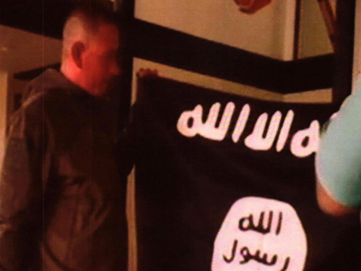 Ikaika Erik Kang is accused of holding an Isis flag while pledging allegiance to the militant group: AP