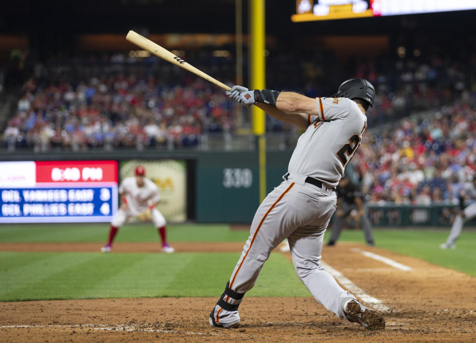 San Francisco Giants' Buster Posey hits a two-run home run during the sixth inning against the Philadelphia Phillies in a baseball game Wednesday, July 31, 2019, in Philadelphia. (AP Photo/Chris Szagola)