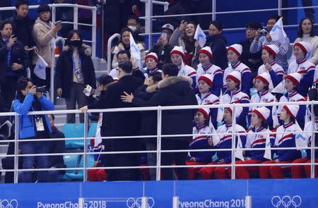 Ice Hockey – Pyeongchang 2018 Winter Olympics – Women's Preliminary Round Match – Korea v Japan - Kwandong Hockey Centre, Gangneung, South Korea – February 14, 2018 - A Kim Jong-un impersonator stands next to the North Korean cheerleaders. REUTERS/Brian Snyder