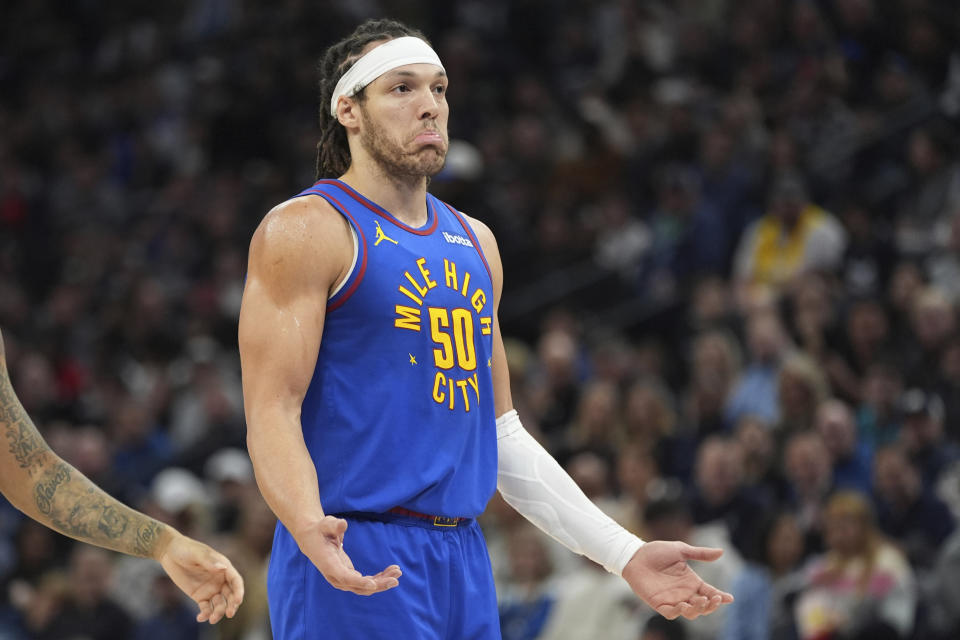 Denver Nuggets forward Aaron Gordon (50) gestures after a call by a referee during the first half of an NBA basketball game against the Minnesota Timberwolves, Tuesday, March 19, 2024, in Minneapolis. (AP Photo/Abbie Parr)