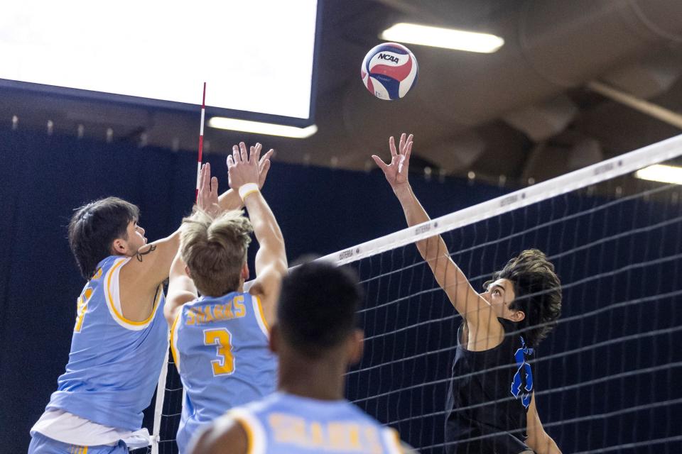 Brigham Young Cougars opposite hitter Kupono Browne (13) jumps for a hit during an NCAA men’s volleyball match against the Long Island Sharks at the Smith Fieldhouse in Provo on Thursday, Feb. 8, 2023. | Marielle Scott, Deseret News