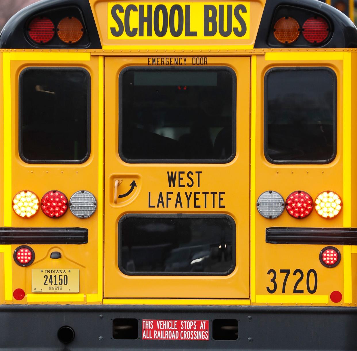 A West Lafayette Community School Corporation bus waits, Tuesday, March 26, 2024, outside of Mackey Arena in West Lafayette, Ind.