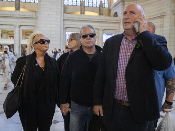 Harry Dunn’s parents with family spokesperson Radd Seiger (AP)