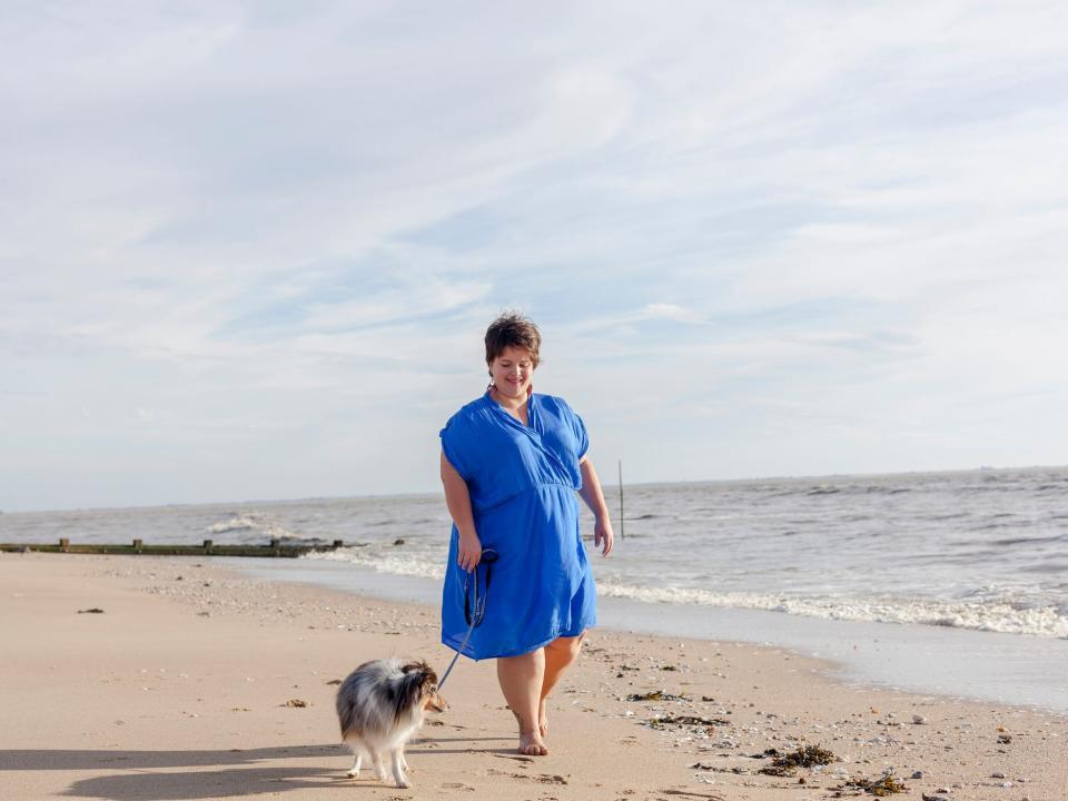 woman walking dog