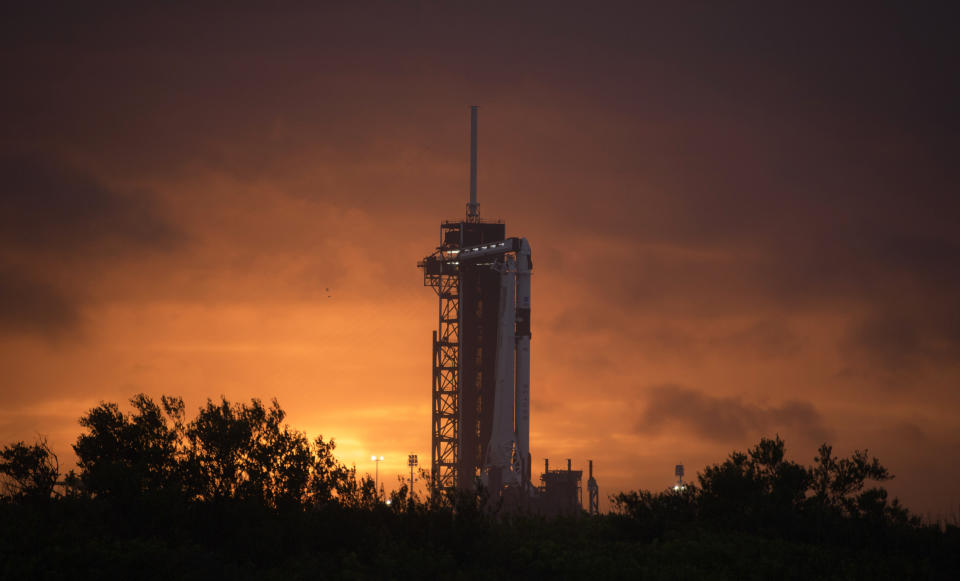 A SpaceX Falcon 9 rocket with the company's Crew Dragon spacecraft onboard is seen on the launch pad at Launch Complex 39A as preparations continue for the Demo-2 mission at NASA's Kennedy Space Center in Cape Canaveral, Fla., Monday, May 25, 2020. (Bill Ingalls/NASA via AP)