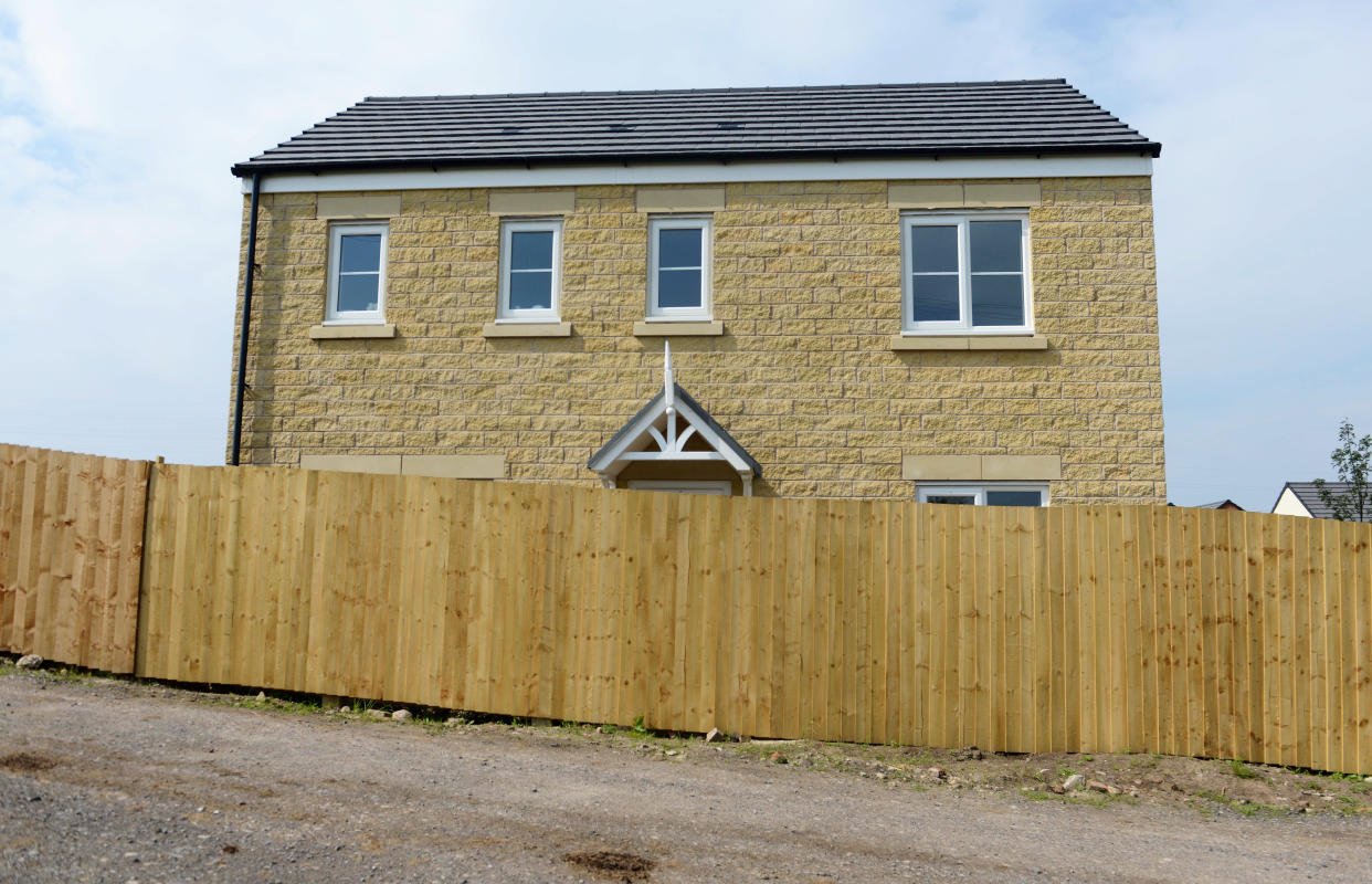 <em>Thomas Entwistle and his wife Rebekah returned from their honeymoon to find a 6ft fence had been put up outside their newly-bought dream home (Picture: SWNS)</em>