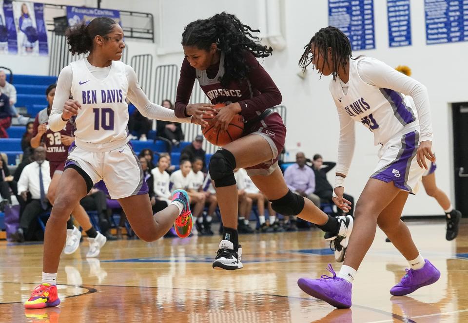Lawrence Central Bears guard Jaylah Lampley (10) rushes up the court against *Ben Davis Giants guard Kaleah Toomer (10) on Saturday, Dec. 10, 2022 at Franklin Central High School in Indianapolis. Ben Davis Giants defeated the Lawrence Central Bears, 67-65. 