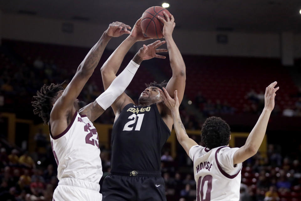 Colorado forward Evan Battey (21) battles Arizona State forward Romello White, left, and Jaelen House (10) for the rebound during the first half of an NCAA college basketball game, Thursday, Jan. 16, 2020, in Tempe, Ariz. (AP Photo/Matt York)