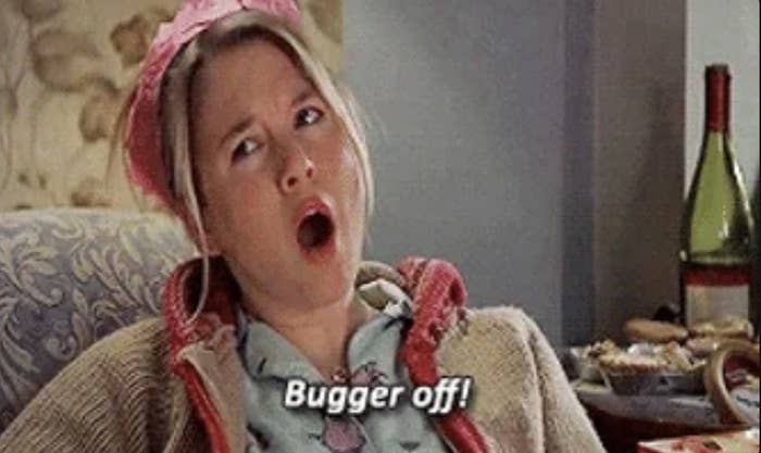 Renee Zellweger, wearing a casual outfit and a pink headband, is lounging and shouting "Bugger off!" in a scene from the movie Bridget Jones's Diary