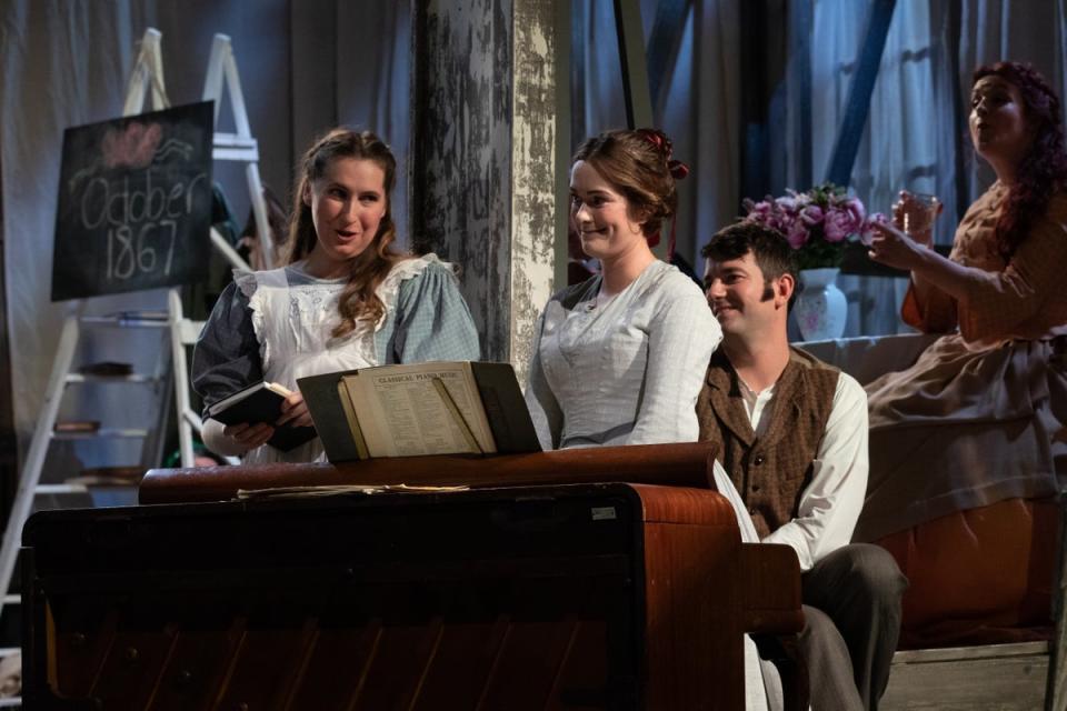 Elizabeth Karani as Amy, Harriet Eyley as Beth and Frederick Jones as Laurie in Little Women (Ali Wright)