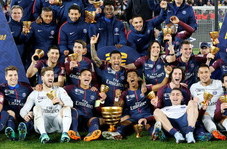 Soccer Football - Coupe de la Ligue Final - Paris St Germain vs AS Monaco - Matmut Atlantique Stadium, Bordeaux, France - March 31, 2018 Paris Saint-Germain players celebrate with the trophy after victory REUTERS/Regis Duvignau