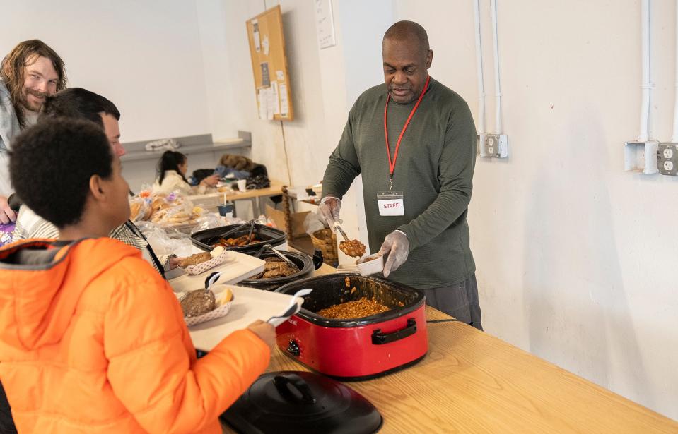 Jerome Jackson serves lunch on Jan. 25, 2024, at The Open Shelter on Parsons Avenue in Columbus.