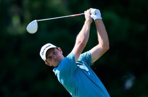 Justin Rose of England watches his tee shot on the ninth hole during the third round of the Tour Championship at East Lake Golf Club in Atlanta, Georgia. Rose fired a two-under par 68 to match American Brandt Snedeker for the lead after Saturday's third round