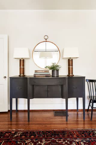 Hector Manuel Sanchez; Styling: Lydia Pursell Dark furnishings stand out against the white walls.