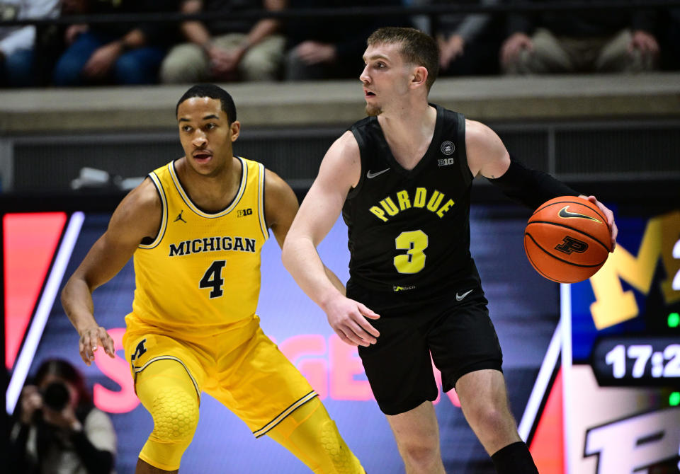 Jan 23, 2024; West Lafayette, Indiana, USA; Purdue Boilermakers guard Braden Smith (3) dribbles the ball away from Michigan Wolverines guard Nimari Burnett (4) during the first half at Mackey Arena.