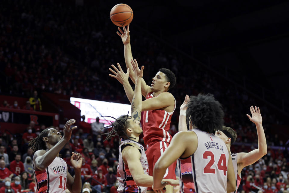 Wisconsin guard Johnny Davis (1) shoots over Rutgers guard Caleb McConnell during the first half of an NCAA college basketball game Saturday, Feb. 26, 2022, in Piscataway, N.J. (AP Photo/Adam Hunger)