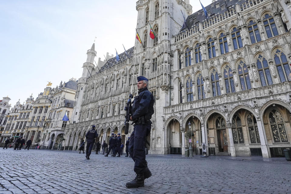 Belgian Police patrol the Grand Place in central Brussels, Tuesday, Oct. 17, 2023, following the shooting of two Swedish soccer fans were shot by a suspected Tunisian extremist on Monday night. Police in Belgium have shot dead a suspected Tunisian extremist accused of killing two Swedish soccer fans in a brazen attack on a Brussels street before disappearing into the night on Monday. (AP Photo/Martin Meissner)