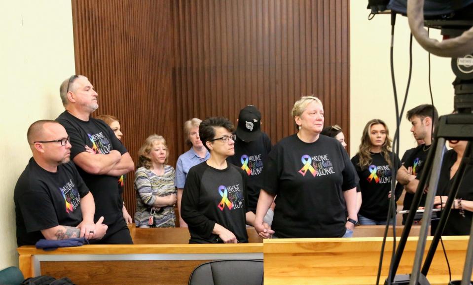 Cathy Barton, right, partner of the late Lisa Stanley Rocheleau of Rochester, is surrounded by "Lisa's Army" supporters in Strafford County Superior Court in Dover Friday, May 12, 2023. They are attending the arraignment of the woman charged with shooting Rocheleau in the Rochester office building where her business was located on May 1.