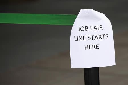 A sign marks the entrance to a job fair in New York in this October 24, 2011 file photo. REUTERS/Shannon Stapleton