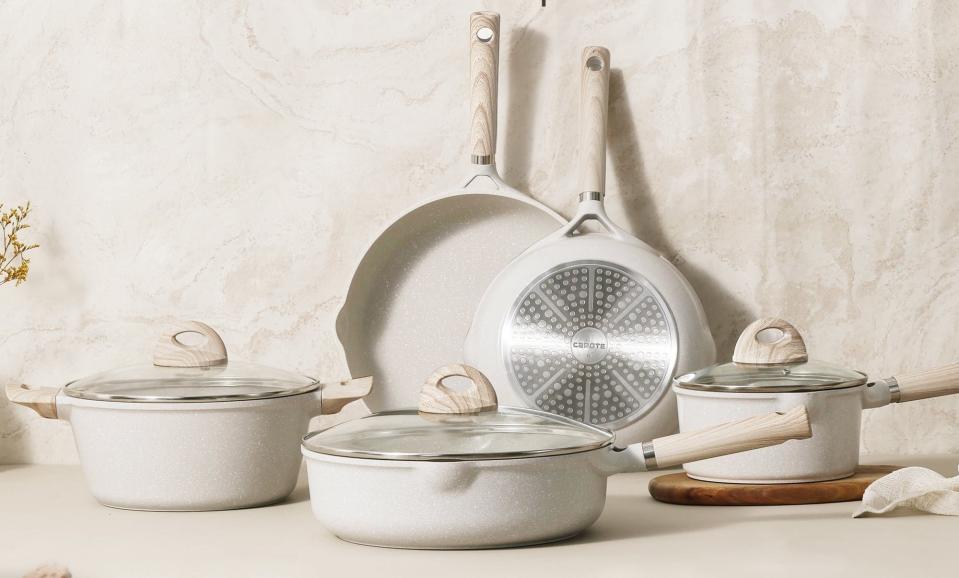 the full set of oatmeal colored pots and pans