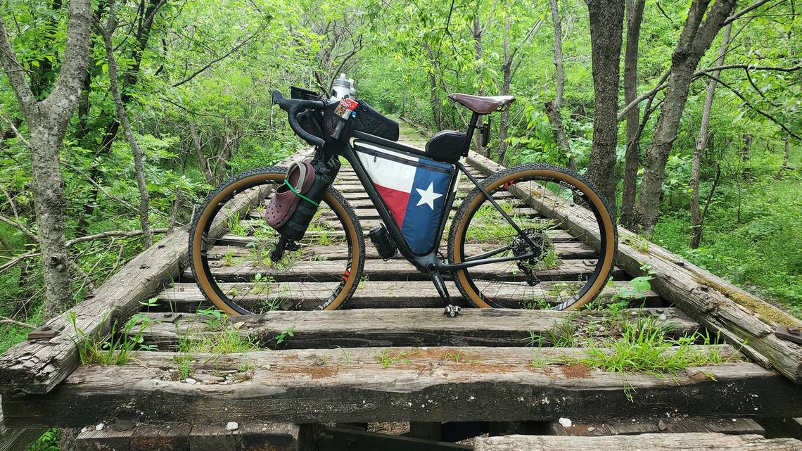 In this spring 2022 photo, cyclist Jeff Mundt’s Salsa Cutthroat gravel bike sits on an old rail bridge on the Northeast Texas Trail, near Wolfe City. The NETT is the longest trail in Texas, stretching 133 miles from Farmersville to New Boston.