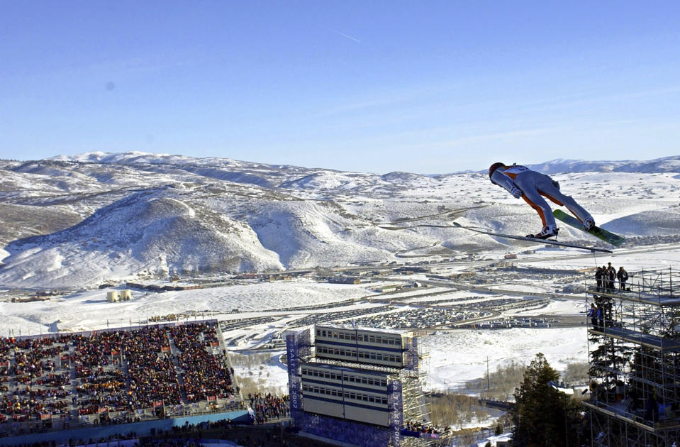 FILE - In this Feb. 10, 2002, file photo, Simon Ammann, of Switzerland, competes in the men's K90 Individual ski jump at the 2002 Salt Lake City Winter Olympics in Park City, Utah. Salt Lake City may shift its focus to bidding for the 2034 Winter Olympics rather than the games four years earlier following the announcement last month that Sapporo, Japan will bid for 2030, organizing committee members said Wednesday, Feb. 12, 2020. (AP Photo/Elise Amendola, File)