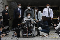 Former South Korean comfort woman Lee Yong-soo in a wheelchair speaks before leaving the Seoul Central District Court in Seoul, South Korea, Wednesday, April 21, 2021. The court on Wednesday rejected a claim by South Korean sexual slavery victims and their relatives who sought compensation from the Japanese government over their wartime sufferings. (AP Photo/Ahn Young-joon)