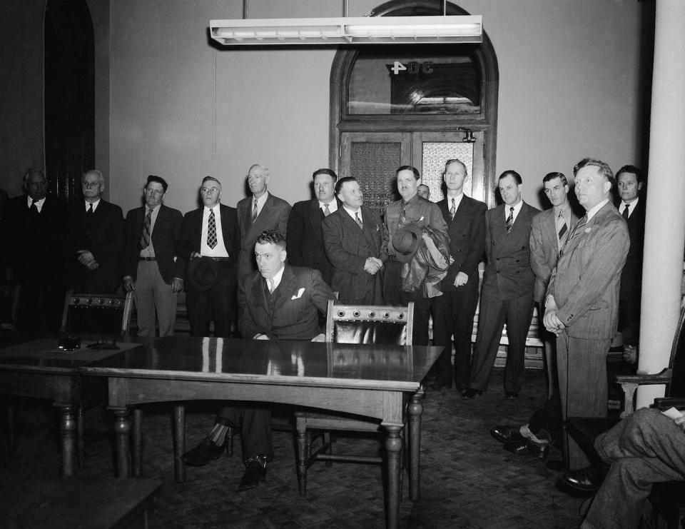 Men being tried for unlawful cohabitation stand in a courtroom in Salt Lake City in 1945. Tensions with the government over polygamy still influence fundamentalist groups’ distrust toward officials today. <a href="https://newsroom.ap.org/detail/CrimePolygamy1945/aa9ca5b70b5a4d8fa84814d980ebc2b5/photo?Query=fundamentalist%20mormon&mediaType=photo&sortBy=&dateRange=Anytime&totalCount=228&currentItemNo=165" rel="nofollow noopener" target="_blank" data-ylk="slk:AP Photo/Anonymous;elm:context_link;itc:0;sec:content-canvas" class="link ">AP Photo/Anonymous</a>