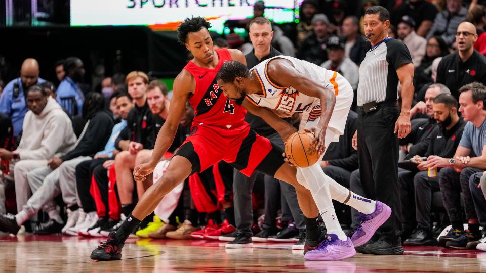 TORONTO, ON - NOVEMBER 29: Scottie Barnes #4 of the Toronto Raptors defends against Kevin Durant #35 of the Phoenix Suns during second half action at the Scotiabank Arena on November 29, 2023 in Toronto, Ontario, Canada. NOTE TO USER: User expressly acknowledges and agrees that, by downloading and/or using this Photograph, user is consenting to the terms and conditions of the Getty Images License Agreement. (Photo by Andrew Lahodynskyj/Getty Images)