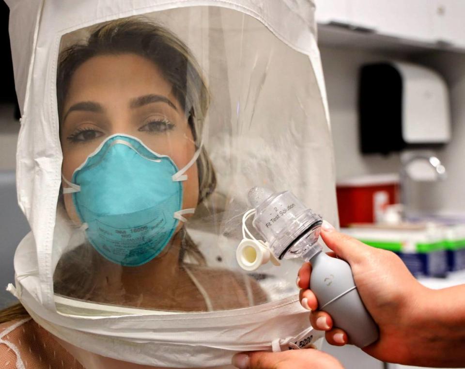 Coronavirus concerns aren’t just in the courtroom. Emergency room RN Erika Juvier, 24, gets fitted with a particulate respirator and surgical mask using a hood and fit test solution to make sure the mask fits properly during the novel coronavirus preparation at Nicklaus Children’s Hospital’s employee headquarters on Thursday, March 5, 2020, in Miami, Florida.