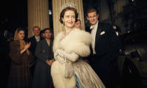 This image released by Netflix shows Claire Foy, center, and Matt Smith, right, in a scene from "The Crown." It took less than a decade for leader Netflix to skyrocket from about 12 million U.S. subscribers at the decade's start to 60 million this year and 158 million worldwide. (Robert Viglasky/Netflix via AP)