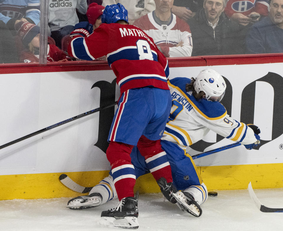 Montreal Canadiens' Mike Matheson (8) is called for boarding on Buffalo Sabres' Zach Benson (9) during the first period of an NHL hockey game Wednesday, Feb. 21, 2024 in Montreal. (Christinne Muschi/The Canadian Press via AP)