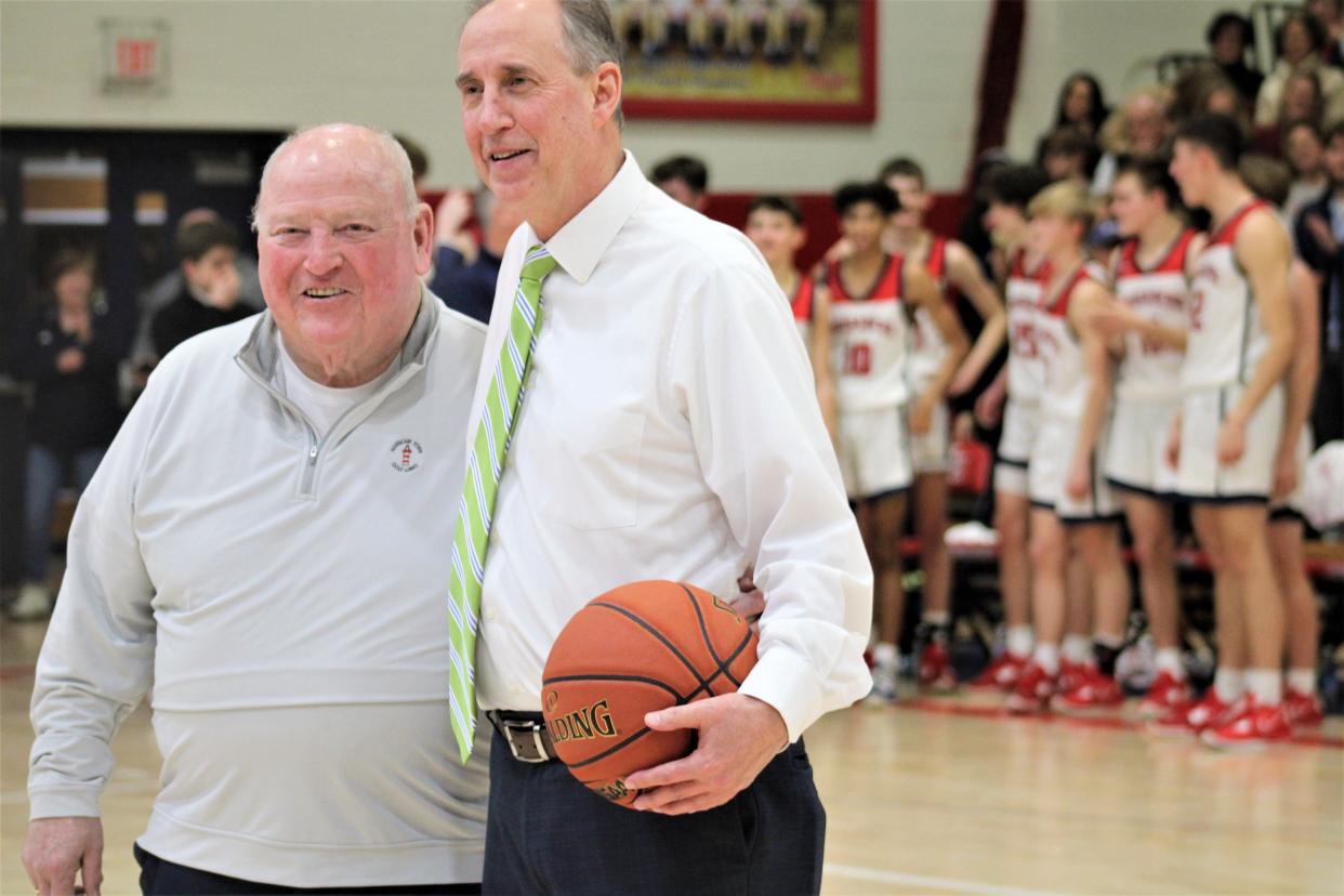 Dave Faust, right, with Ken Shields after Faust broke Shields' career record. St. Henry boys basketball defeated Bluegrass United 84-45 Jan. 27. 2023 at St. Henry. The win was the 461st in the 31-year head coaching career of Dave Faust, breaking the KHSAA Ninth Region boys basketball record formerly held by Ken Shields.