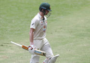 Australia's Steve Smith walks from the field after he was dismissed during play on day four of the fourth cricket test between India and Australia at the Gabba, Brisbane, Australia, Monday, Jan. 18, 2021. (AP Photo/Tertius Pickard)