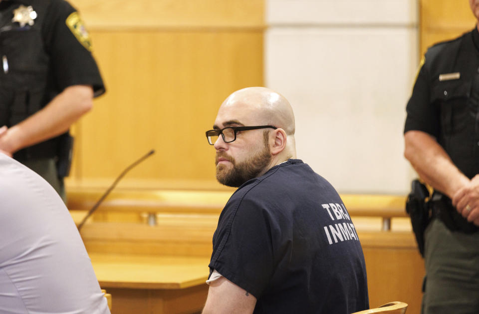 Joseph Eaton listens to Judge Daniel Billings speak during his arraignment at West Bath District Court on Friday, July 28, 2023. who told police he killed his parents and their friends and shot at motorists on a busy interstate highway might try to show he was insane, based on pleas he entered Friday. The 34-year-old ex-convict Joseph Eaton entered pleas of both not guilty and not criminally responsible, leaving him the option of an insanity defense against charges including four counts of murder.(Brianna Soukup/Portland Press Herald via AP, Pool)