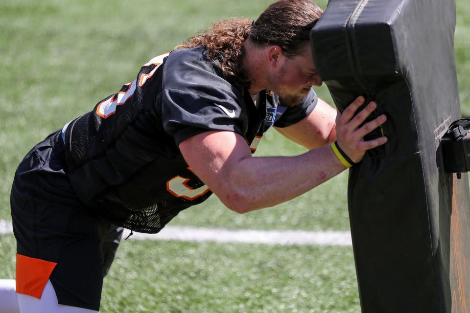 Wyatt Hubert participates in drills during a Cincinnati Bengals minicamp in May 2021. Hubert, a former Kansas State defensive end from Topeka, announced his retirement from football Saturday.