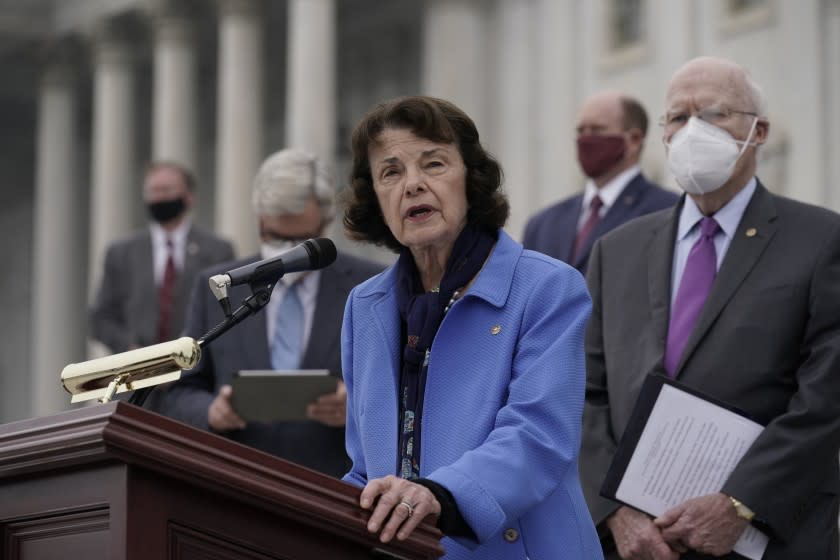 Sen. Dianne Feinstein, D-Calif., and Democratic members of the Senate Judiciary Committee hold a news conference after boycotting the vote by the Republican-led panel to advance the nomination of Judge Amy Coney Barrett to sit on the Supreme Court, Thursday, Oct. 22, 2020, in Washington. (AP Photo/J. Scott Applewhite)