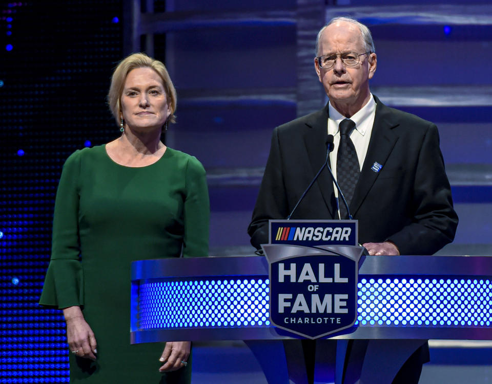 FILE - CEO and Chairman of NASCAR Jim France, right, along with the Executive Vice President of NASCAR Lesa Kennedy announce the Landmark Award to Edsel Ford II the Hall of Fame induction ceremony in Charlotte, N.C. Jan. 31, 2020. NASCAR marks its 75th year in 2023, recalling both its highs and lows. (AP Photo/Mike McCarn, File)