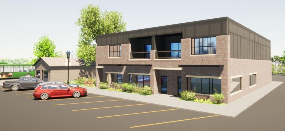 A rendering shows the vision for a small mixed-use apartment and commercial building at 212 SE. Main St. in Grimes.